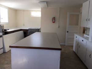 This is a picture of the large island counter space in the middle of the kitchen